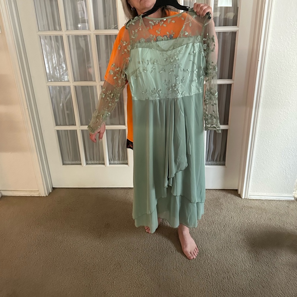 Light green dress w/ ruffles & lace sleeves. Never worn but didnt come with tags